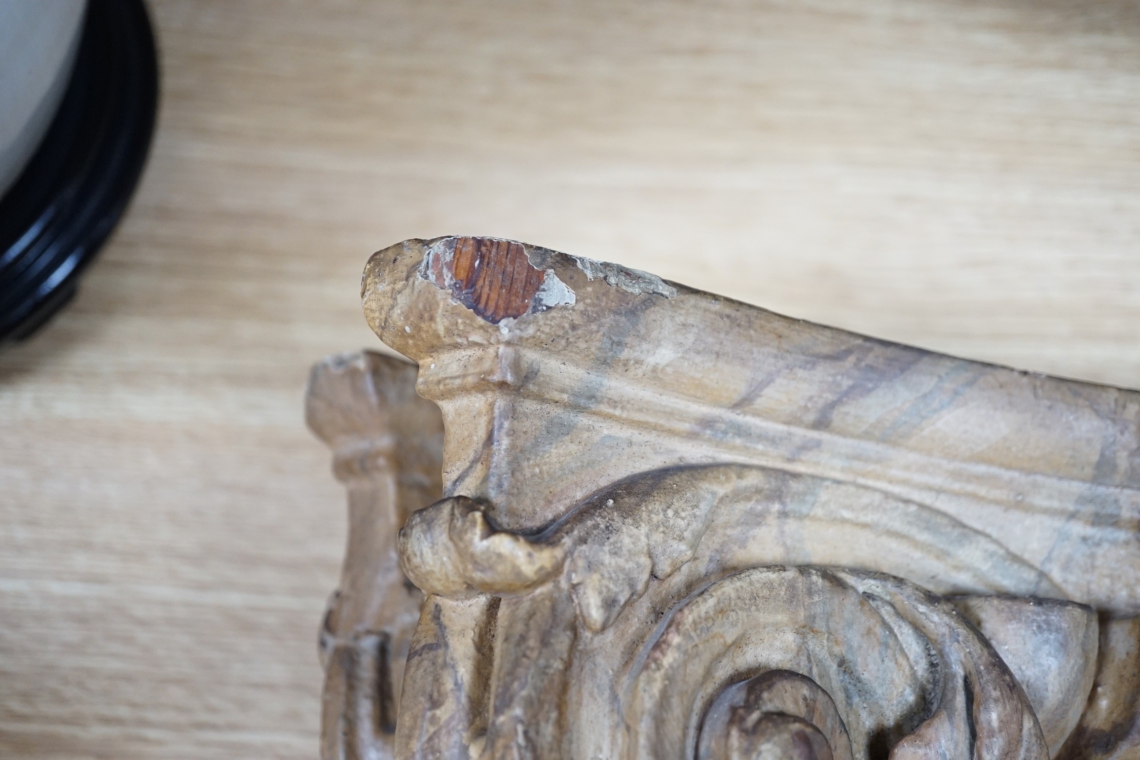 A large 19th century carved pine and gilt-gesso Corinthian capital, 33cms high x 41cm wide (at the top)